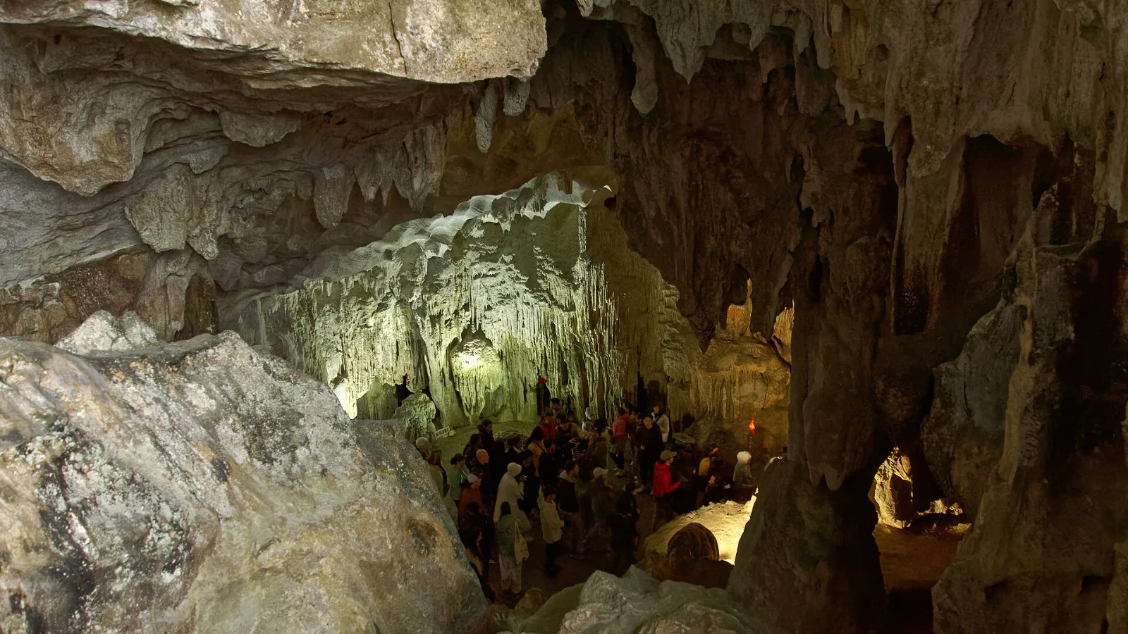 Rock formations lit inside Sung Sot Cave in Ha Long Bay