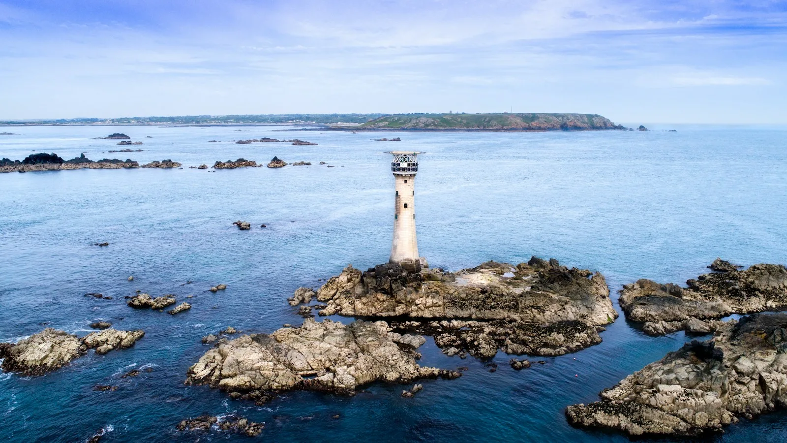 A lighthouse on the rocky coast of Guernsey