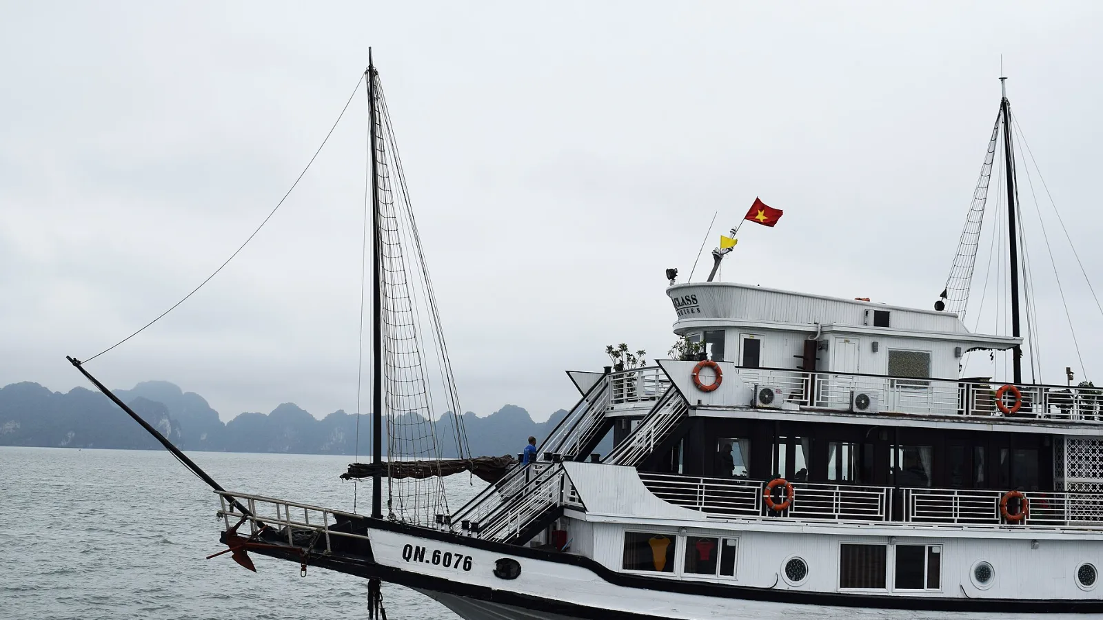 A traditional-style cruise boat among the limestone islands of Ha Long Bay
