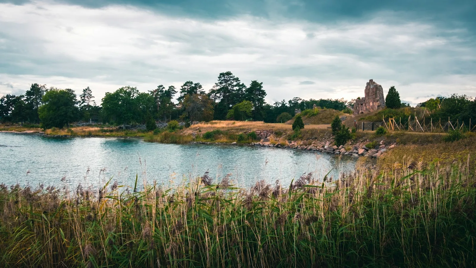 Wooden boathouses on the water in the Åland Islands