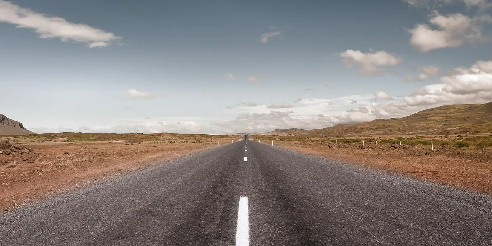 Check road conditions before leaving cellular coverage Traveler checking a route and weather before driving in Iceland