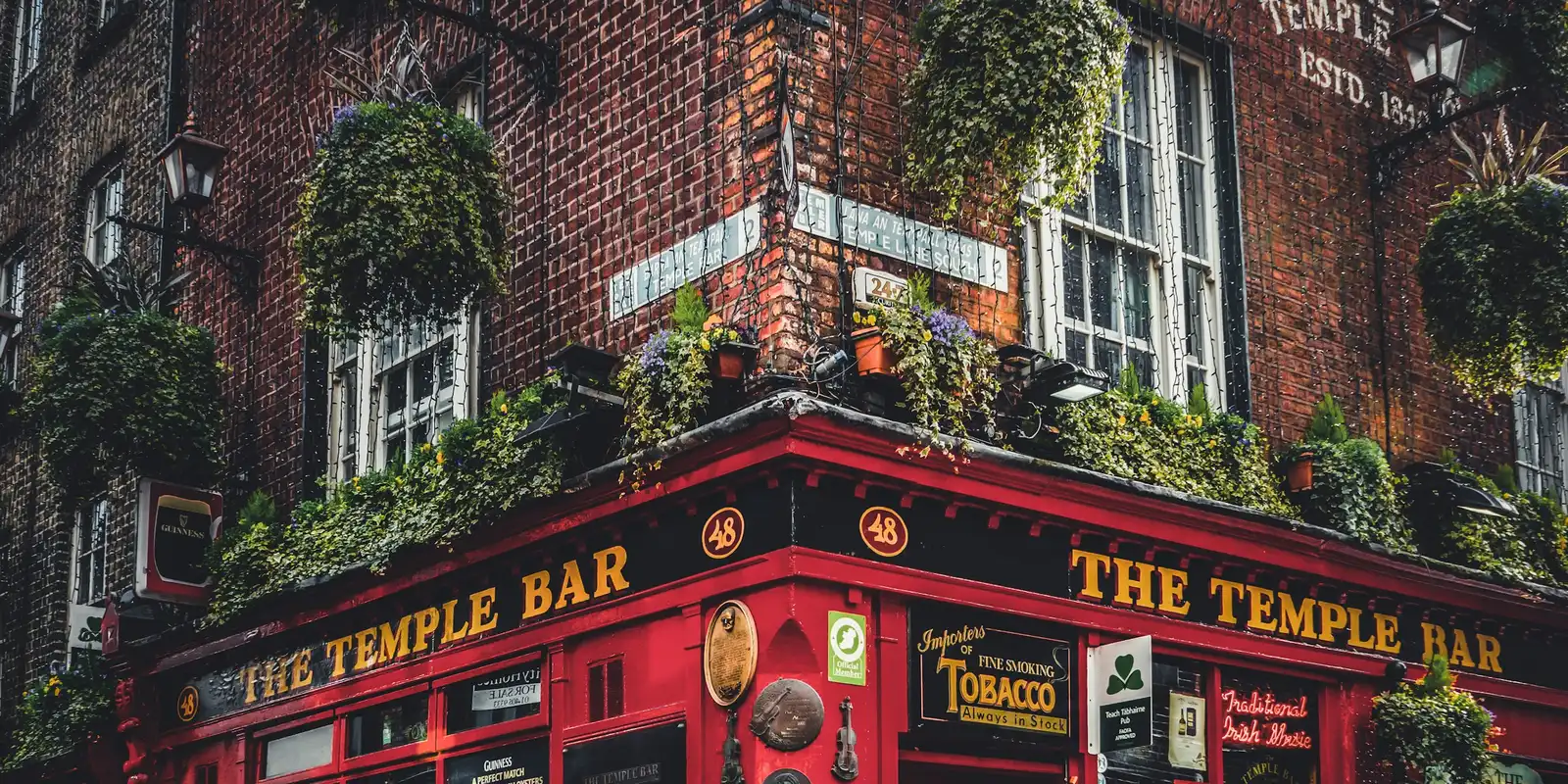 Dublin's Temple Bar district — Three's network tends to lead on speed in Ireland's cities Temple Bar district in Dublin at street level, red-brick building with hanging flower baskets