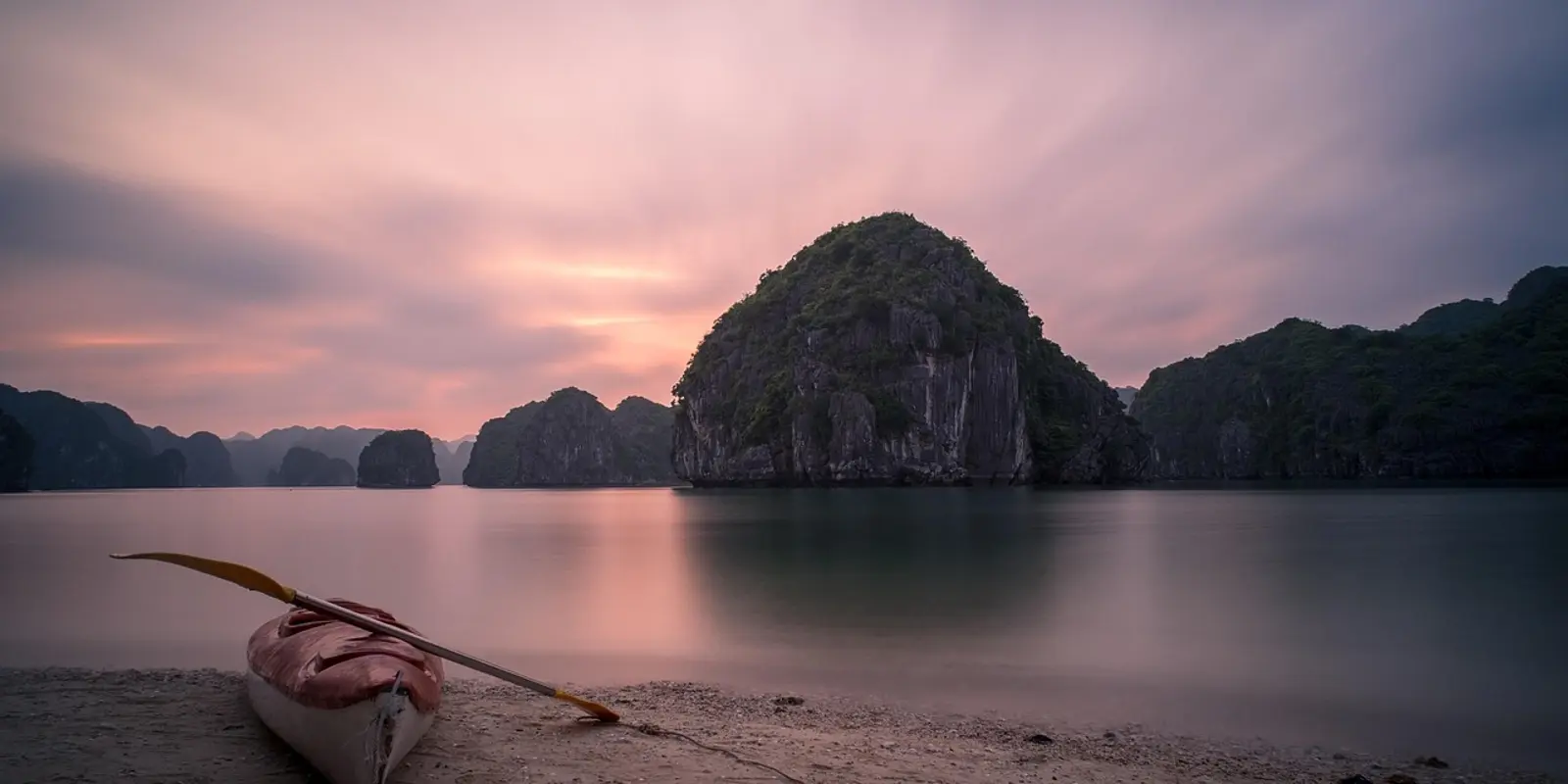 Ha Long Bay: strong coverage near the towns and cruise ports, weaker out among the limestone karsts Ha Long Bay at sunset with a kayak resting on the shore