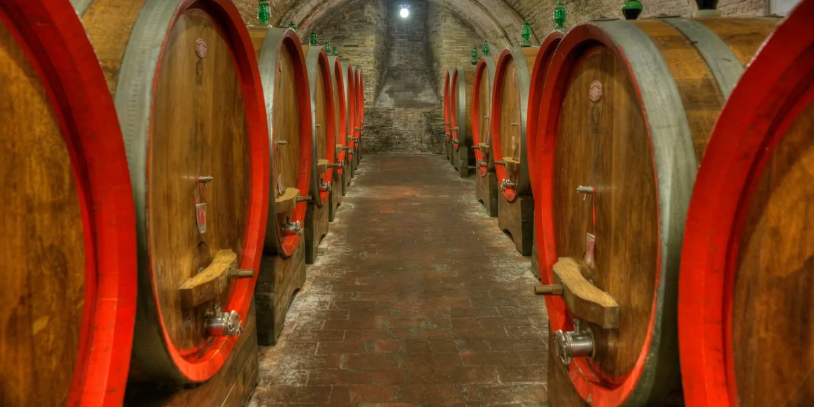 Moldova's Cricova and Mileștii Mici cellars hold millions of bottles in similar limestone tunnels near Chișinău Rows of wine barrels lining an underground cellar tunnel