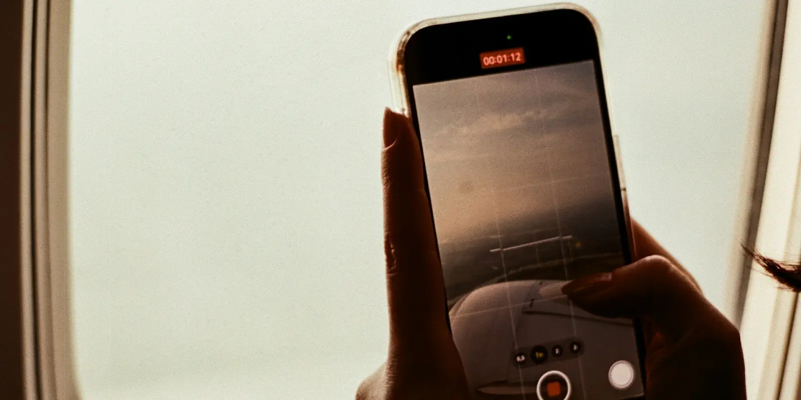 Traveler checking phone settings before an international flight