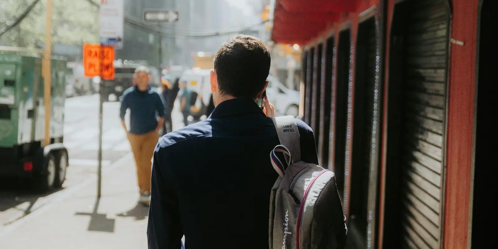 Traveler with a backpack exploring a city street during a longer trip